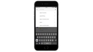YouTube on iOS search uses autocomplete and voice search, which supports people who struggle with inputting text