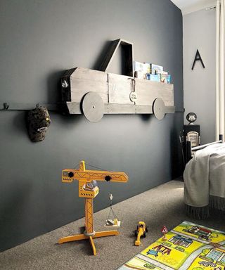 A grey car-shaped DIY book shelf
