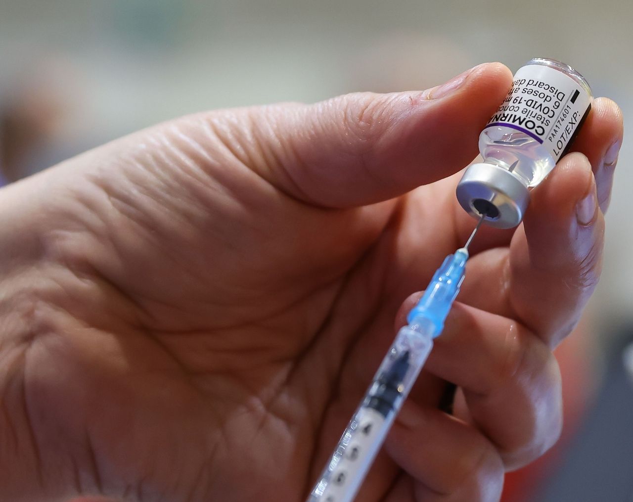 Nurse filling syringe