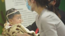 A child at a hospital in Hangzhou, Zhejiang province, China, 6 January, 2025