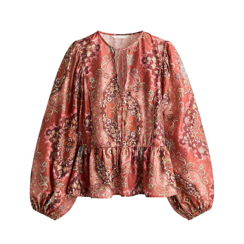 A cutout of a H&amp;amp;M floral peplum blouse
