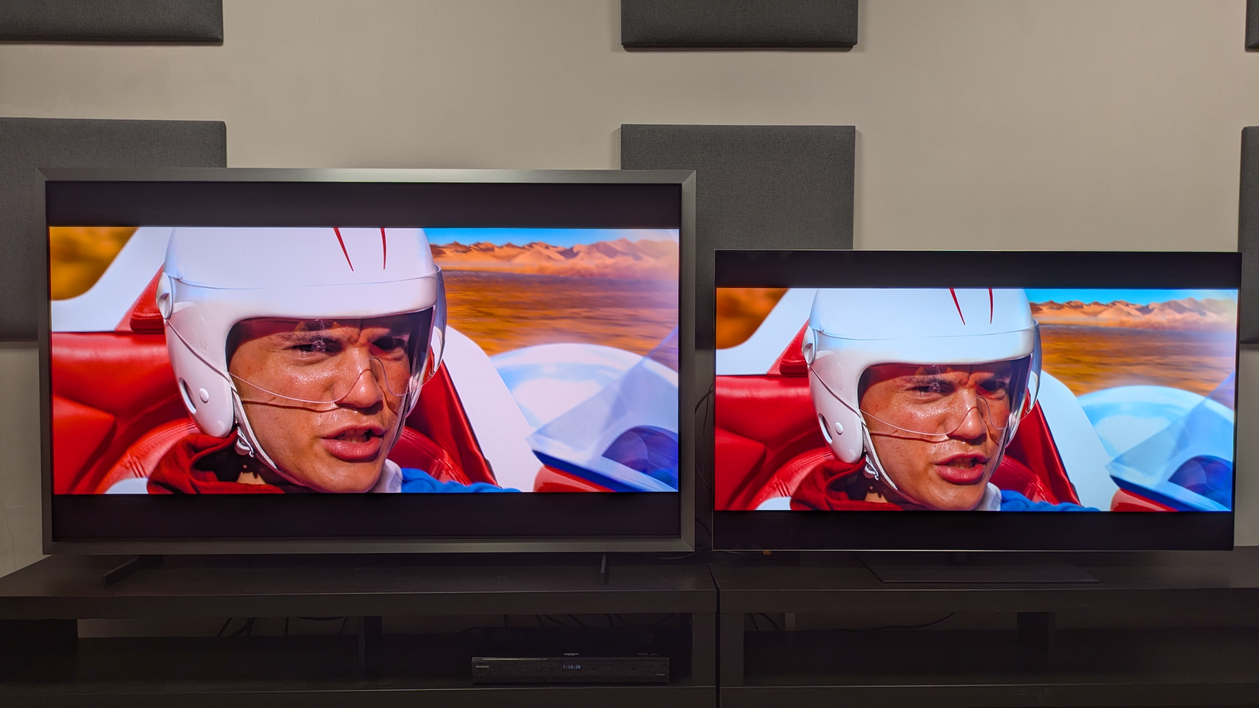 Samsung S99H (left) vs LG G6 (right) showing a close-up shot of Speed Racer from speed Racer. The G6 shows punchier colors, while the S99 shows higher brightness