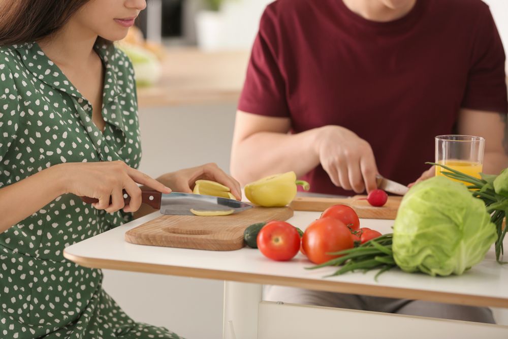 man and woman cooking, cooking, healthy diet