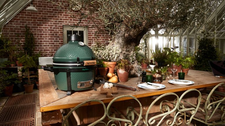 best kamado grill - Big Green Egg BBQ on an outdoor table