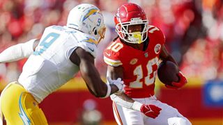 siah Pacheco #10 of the Kansas City Chiefs runs with the ball during the first quarter against the Los Angeles Chargers at GEHA Field at Arrowhead Stadium 