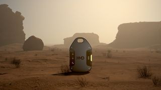 Photo of the HMD OffGrid satellite tool standing upright in the desert