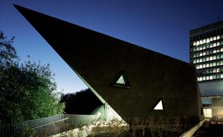 Triangular windows, sweeping black roof
