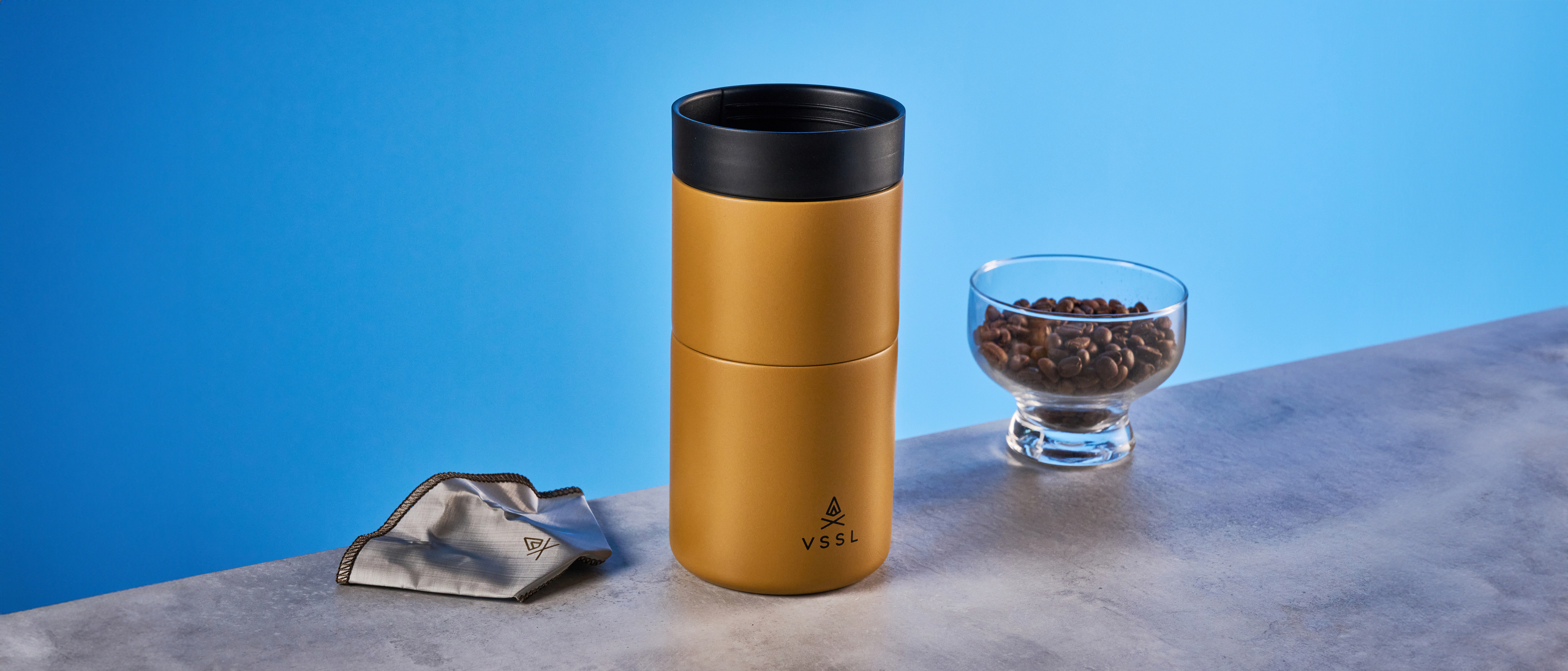 the VSSL Nest Pour Over Coffee Set in gold photographed against the blue tom's guide background