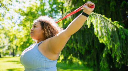 woman doing resistance band workout