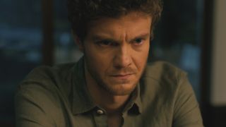 Jack Quaid sits scowling in Companion.