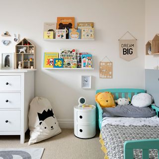 kids bedroom with wooden flooring and basket