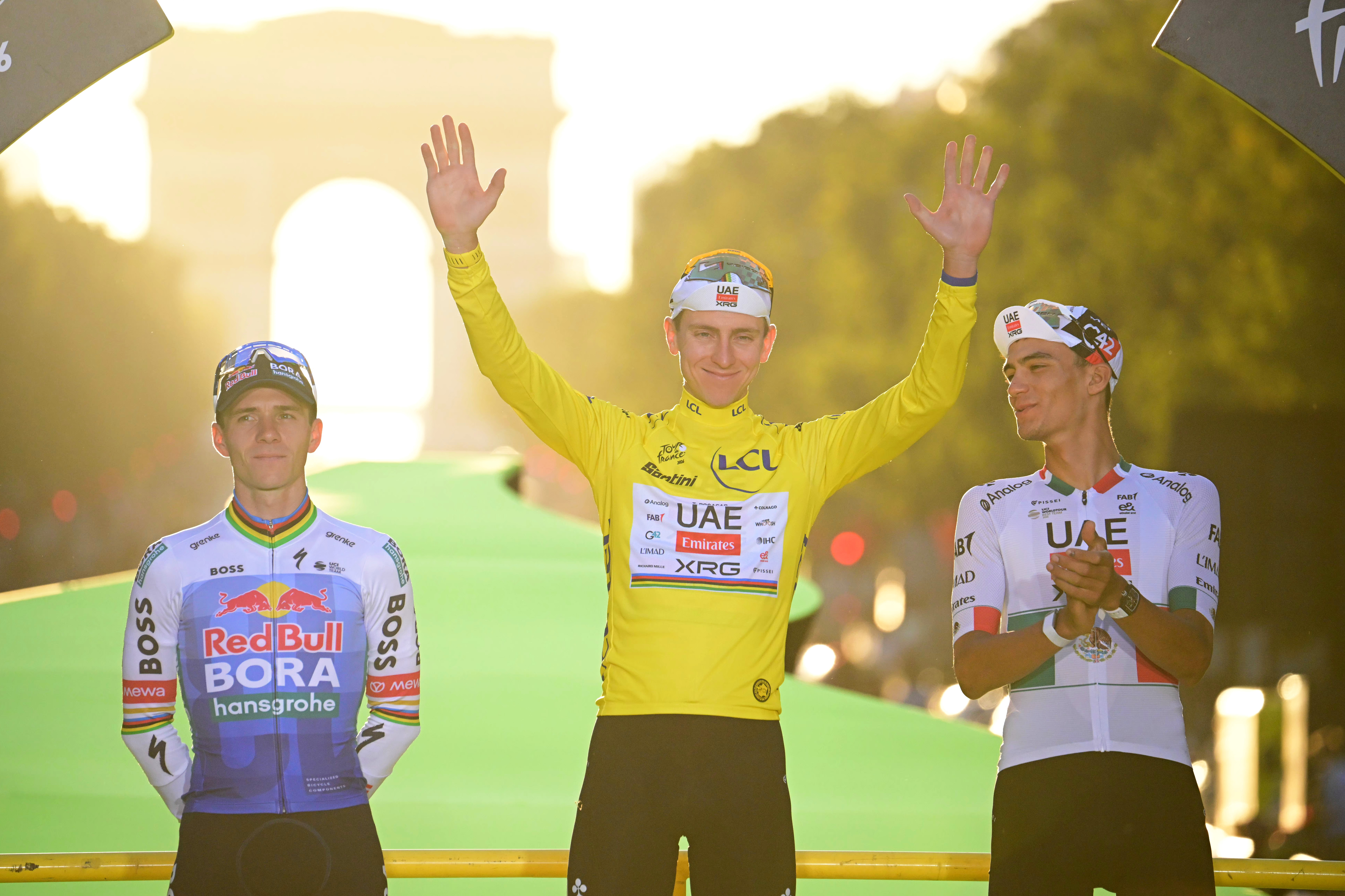 PARIS, FRANCE - JULY 26: (L-R) Remco Evenepoel of Belgium and Team Red Bull - BORA - hansgrohe on second place, final overall winner - Tadej Pogacar of Slovenia and UAE Team Emirates - XRG - Yellow Leader Jersey and Isaac Del Toro of Mexico and UAE Team Emirates - XRG on third place pose on the podium ceremony after the 113th Tour de France 2026, Stage 21 a 89km stage from Paris to Paris / #UCIWT / on July 26, 2026 in Paris, France. (Photo by Bernard Papon - Pool/Getty Images)