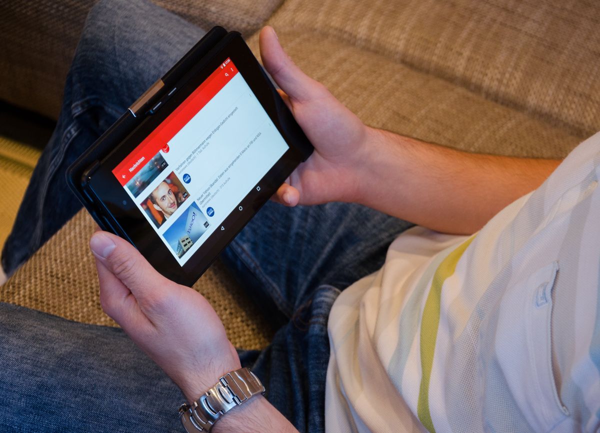 A child watching YouTube on their tablet.