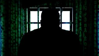 Person in jail, with data scrolling around them