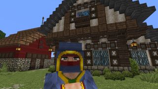 Minecraft texture packs - the John Smith Legacy pack showing a wandering trader in front of a tudor house