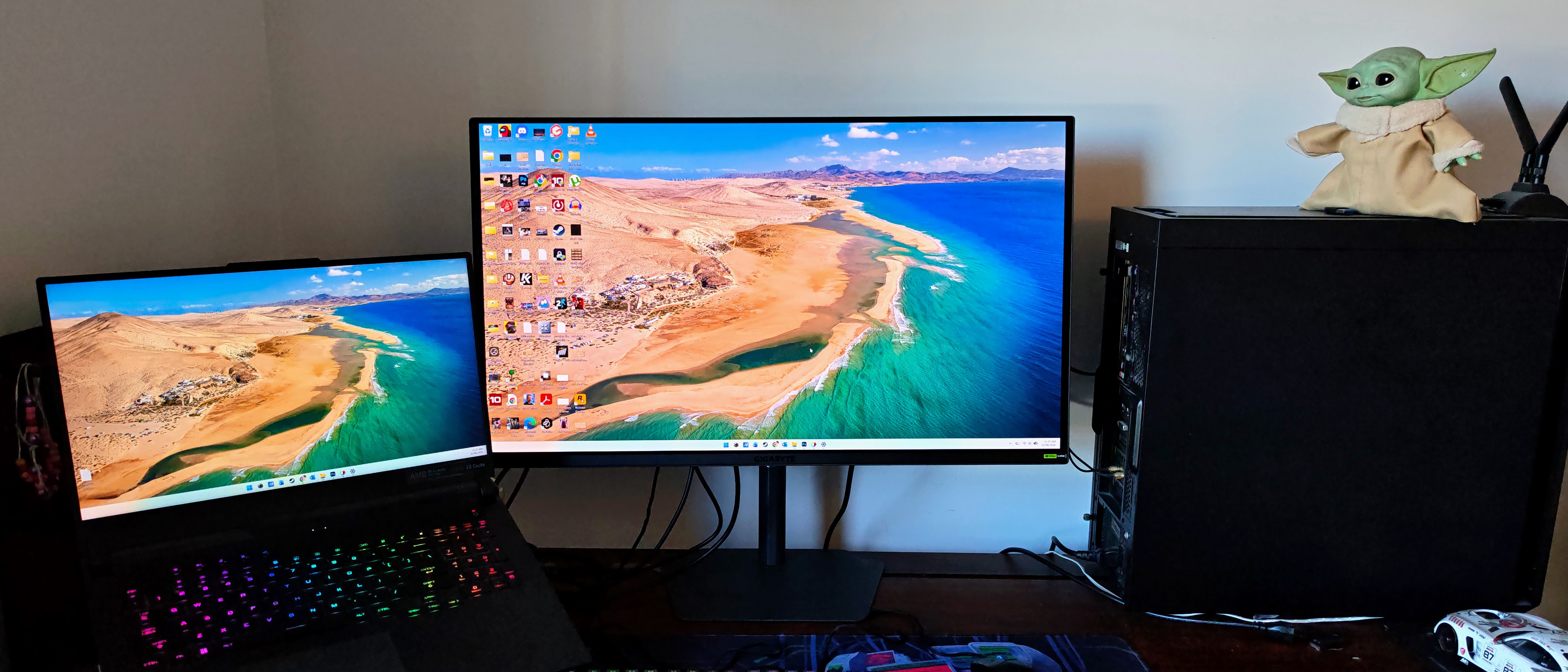 Gigabyte MO32U24 gaming monitor on a desk wide angle