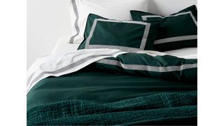A emerald green duvet cover is great for a simple and sleek Christmas bedding.