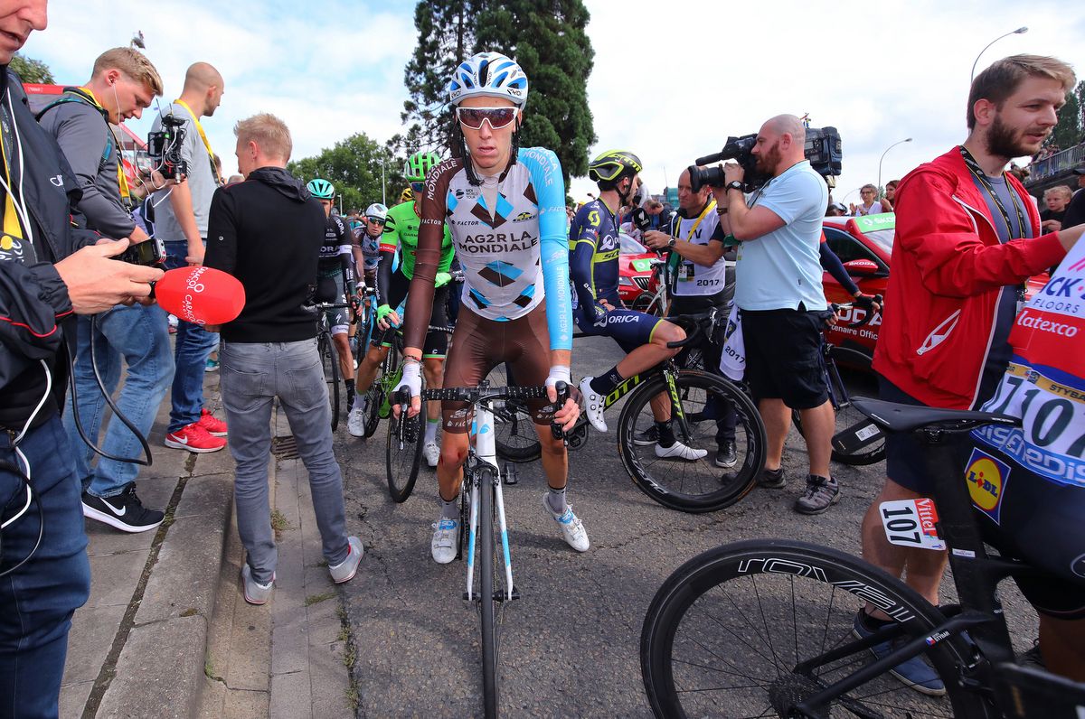 Romain Bardet tries to find the team bus after the stage finish