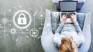 A padlock icon next to a woman working on a laptop