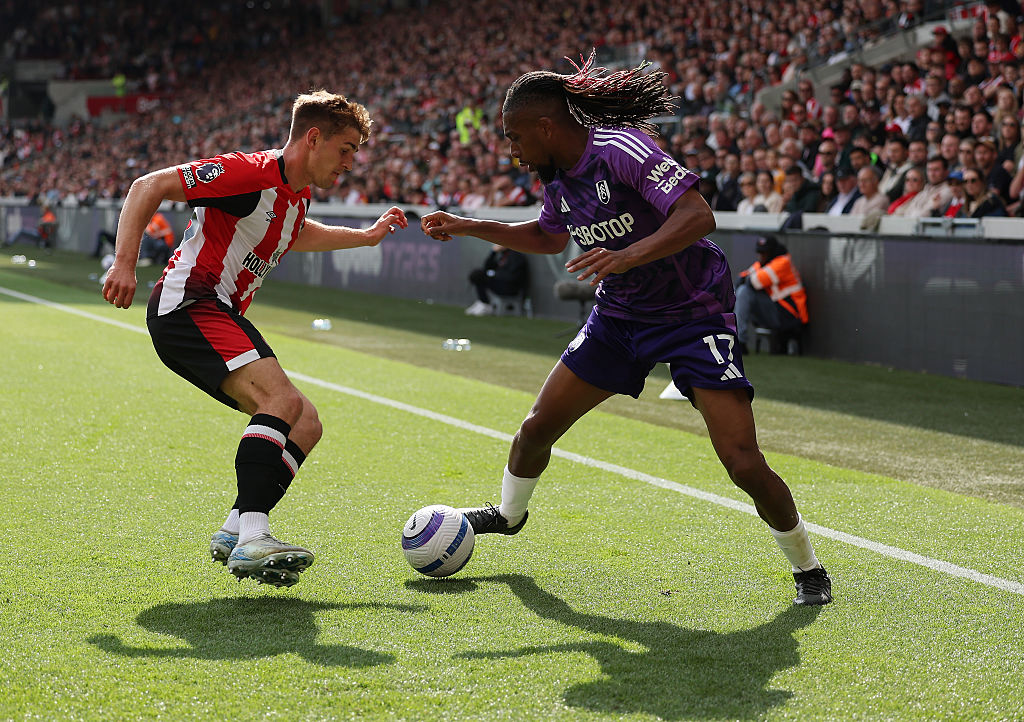 Alex Iwobi of Fulham battles with Yegor Yarmolyuk of Brentford during the Premier League match between Brentford FC and Fulham FC at Gtech Community Stadium on May 18, 2025 in Brentford, England.