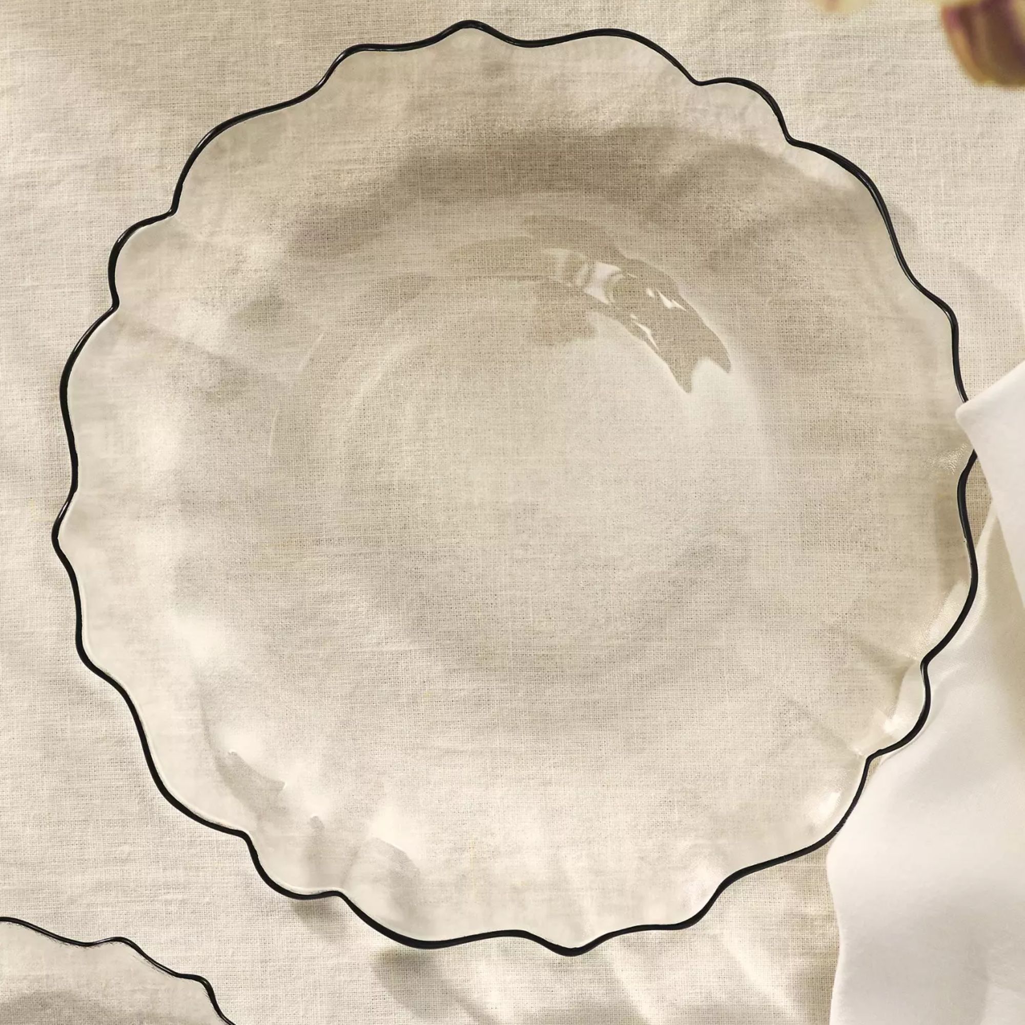 Glass dinner plates with a scalloped edge