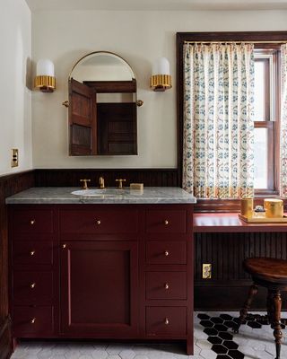 oxblood vanity in a transitional style bathroom