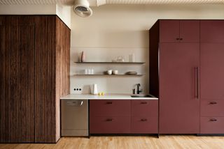 Painted burgandy red kitchen cabinets