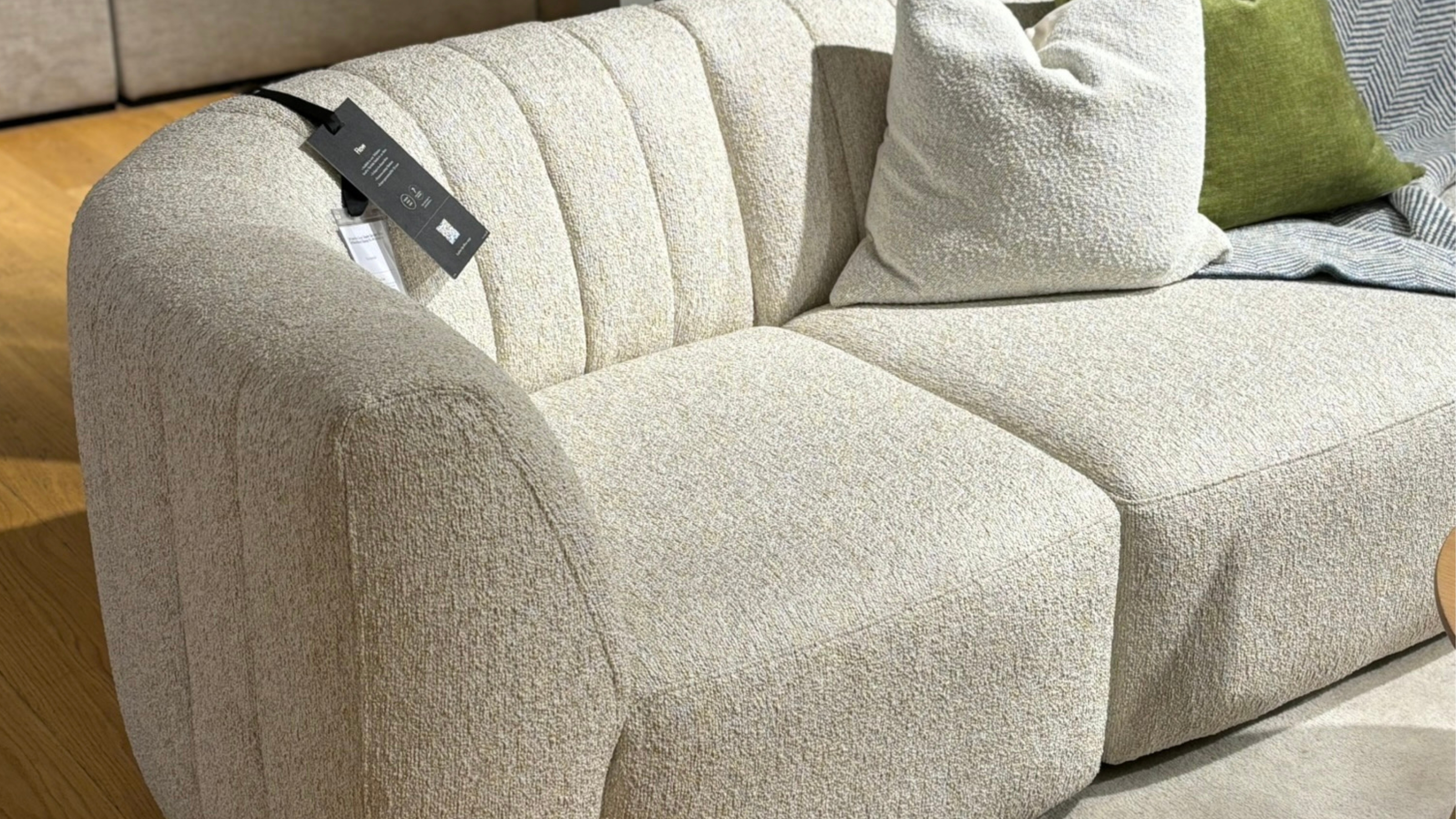 John Lewis boucle sofa close up in a store