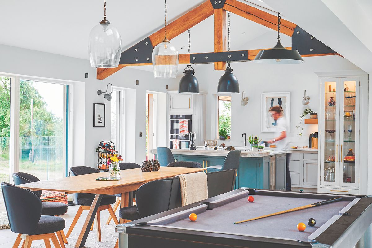 open plan kitchen diner with exposed beams