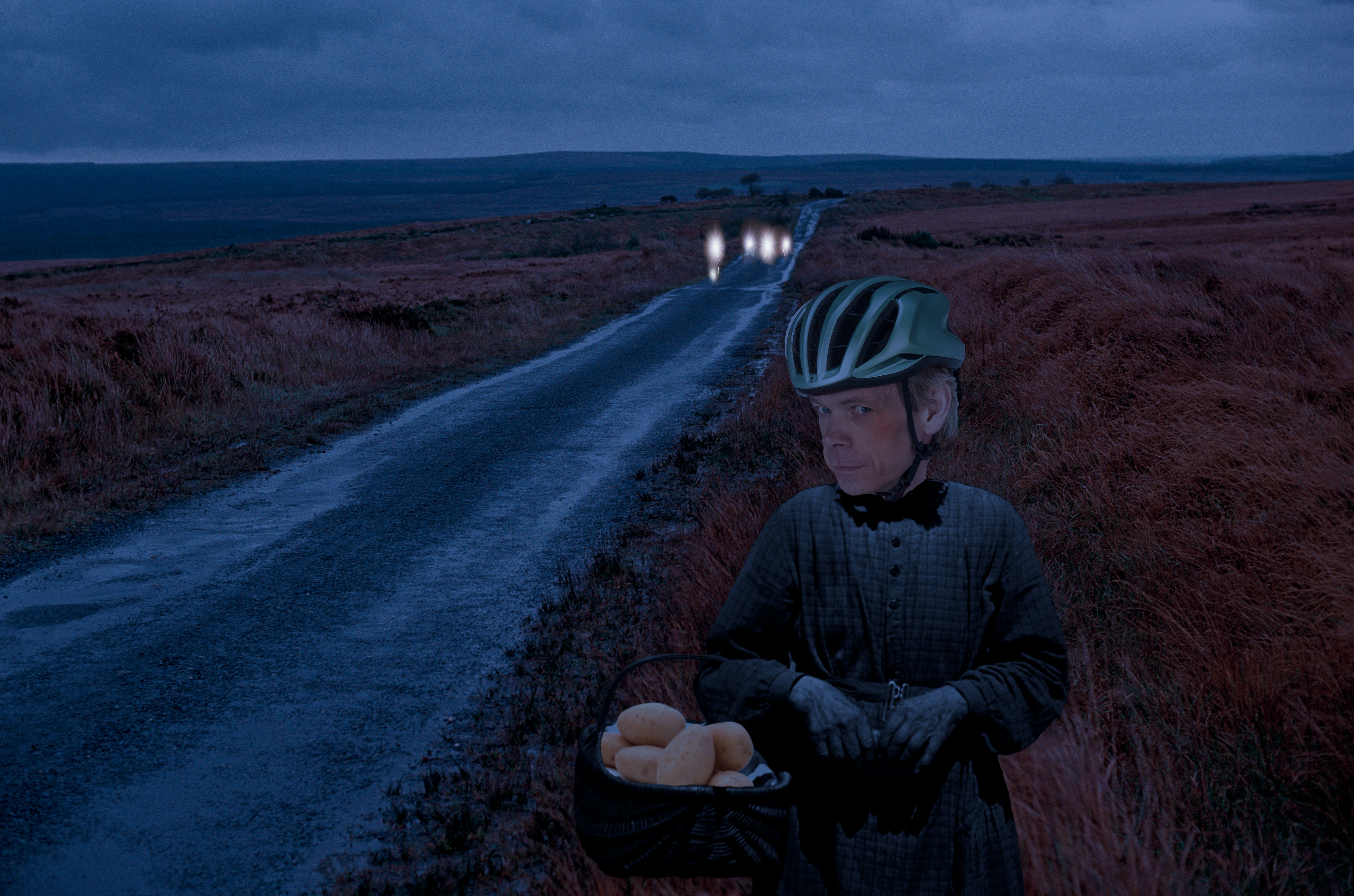 Image of Dr Hutch on a dark road holding pan of potatoes