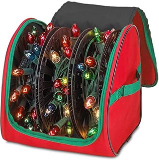 Premium Christmas Light Storage Bag in red. The zip is open and three reels of colorful large bulb lights are visible