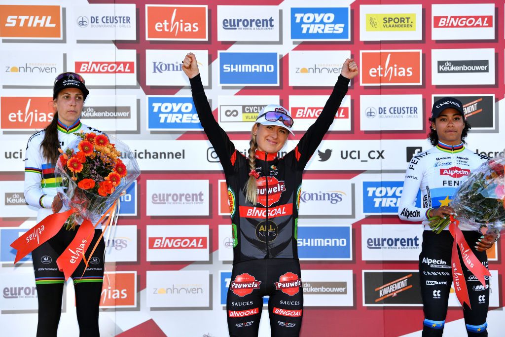 ZONHOVEN BELGIUM OCTOBER 24 LR Lucinda Brand of The Netherlands and Team Baloise Trek Lions on second place race winner Denise Betsema of The Netherlands and Team Pauwels Sauzen Bingoal and Ceylin Del Carmen Alvarado of The Netherlands and Team Alpecin Fenix on third place pose on the podium ceremony after the 25th Zonhoven UCI CycloCross Worldcup 2021 Womens Elite CXWorldCup UCIcyclocrossWC zonhoven on October 24 2021 in Zonhoven Belgium Photo by Luc ClaessenGetty Images