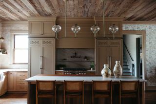 a wooden kitchen with ventilated cabinets