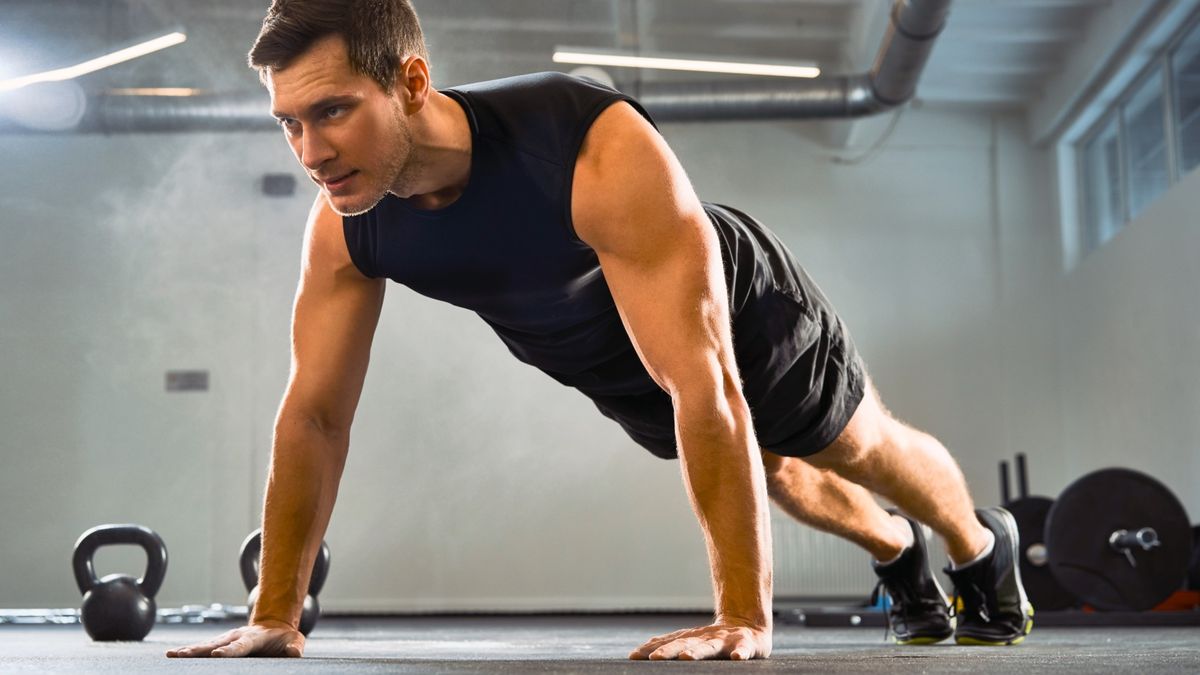 man performing a push up