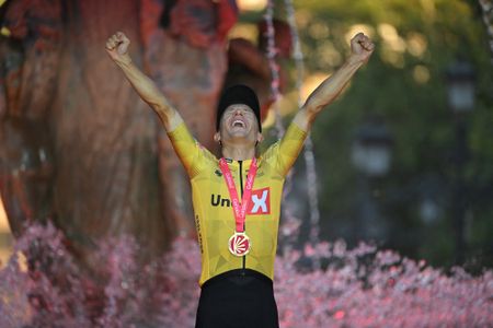 Team Uno-X's Norwegian rider Tobias Johannessen celebrates on the podium winning the 21st and final stage of the Vuelta a Espana 2026 cycling tour, a 112 km race between Granada and Granada, on September 13, 2026. (Photo by JORGE GUERRERO / AFP)
