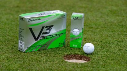 A box of TaylorMade V3 Soft golf balls