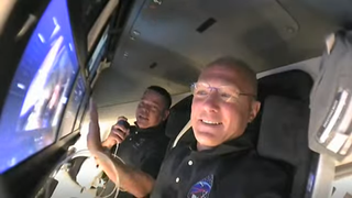 NASA astronauts Bob Behnken (background) and Doug Hurley (foreground) gave a live tour inside SpaceX's Crew Dragon capsule after launching on May 30, 2020