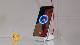 A OnePlus 9 Pro on a charging dock