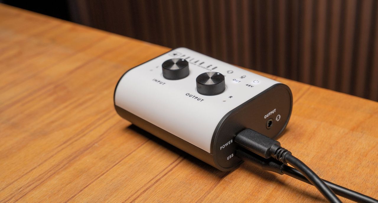 Blackstar Amplification Polar Go: the super-compact audio interface has a white fascia, black knobs and sides, and is small enough to fit inside the palm of your hand.