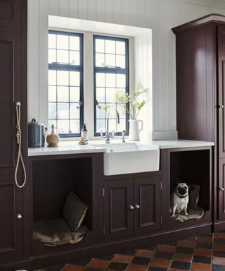 maroon utility room with dog beds built into base cabinets