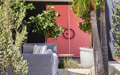 a red door in a backyard