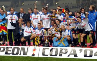 Real Zaragoza players celebrate with the trophy after victory in the 2004 Copa del Rey final against Real Madrid.