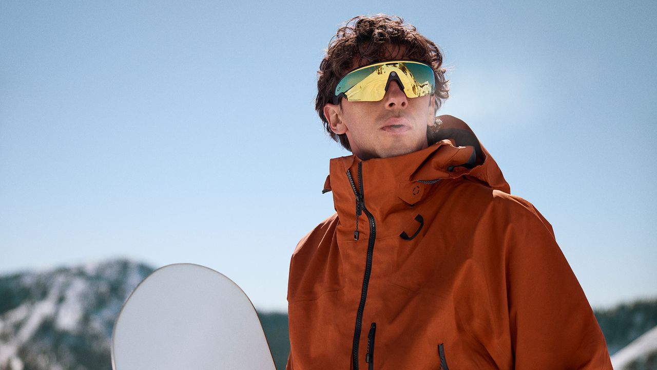 An official lifestyle image of a person wearing Oakley Meta Vanguard smart glasses
