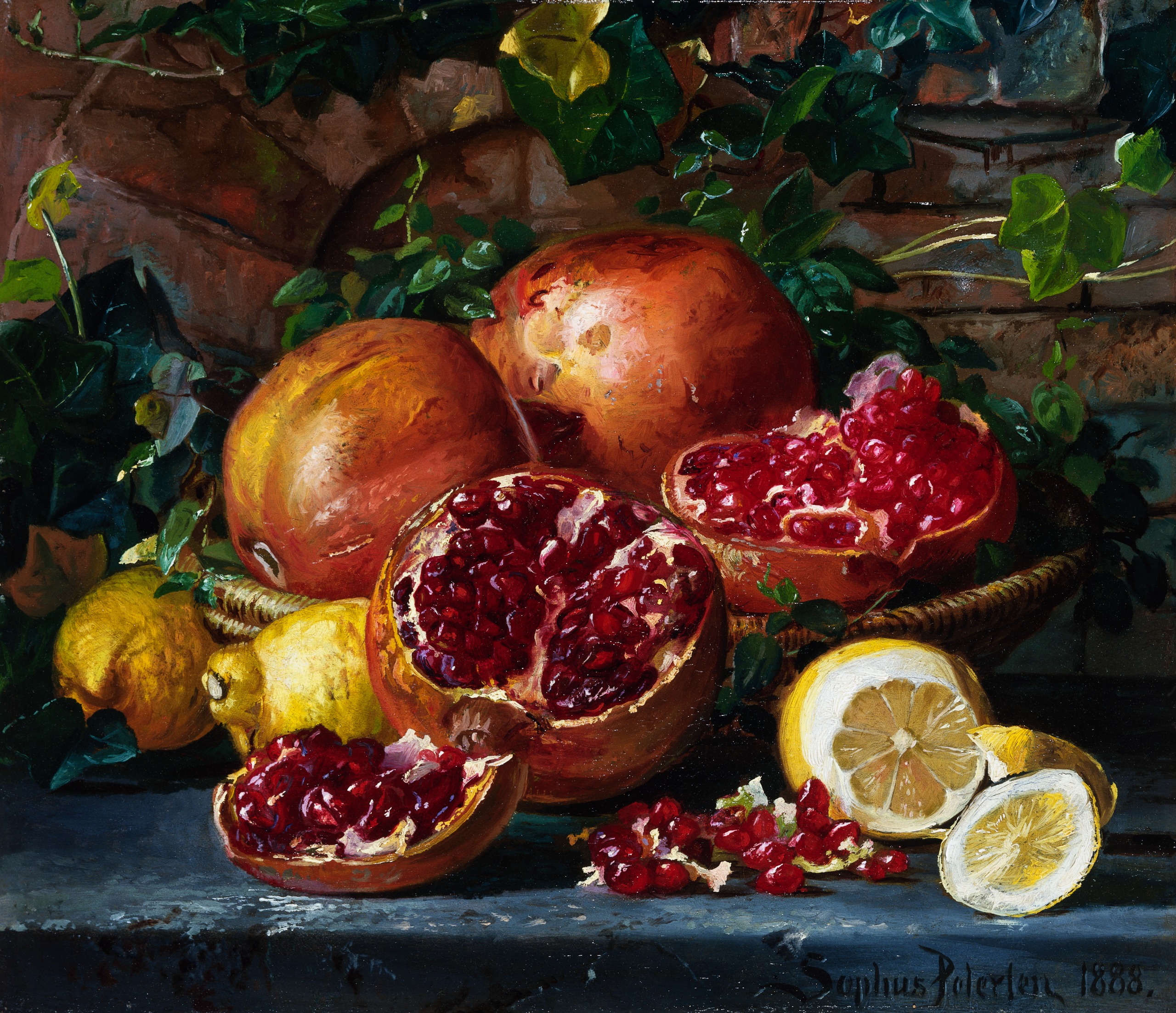 Still life of pomegranates in a fruit bowl, some closed and some cut open spilling over the edge. A sliced lemon is on the right with some whole lemons on the left.