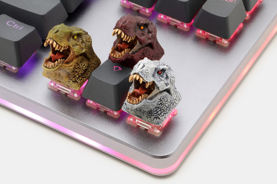 Dinosaur keycaps for mechanical keyboards.