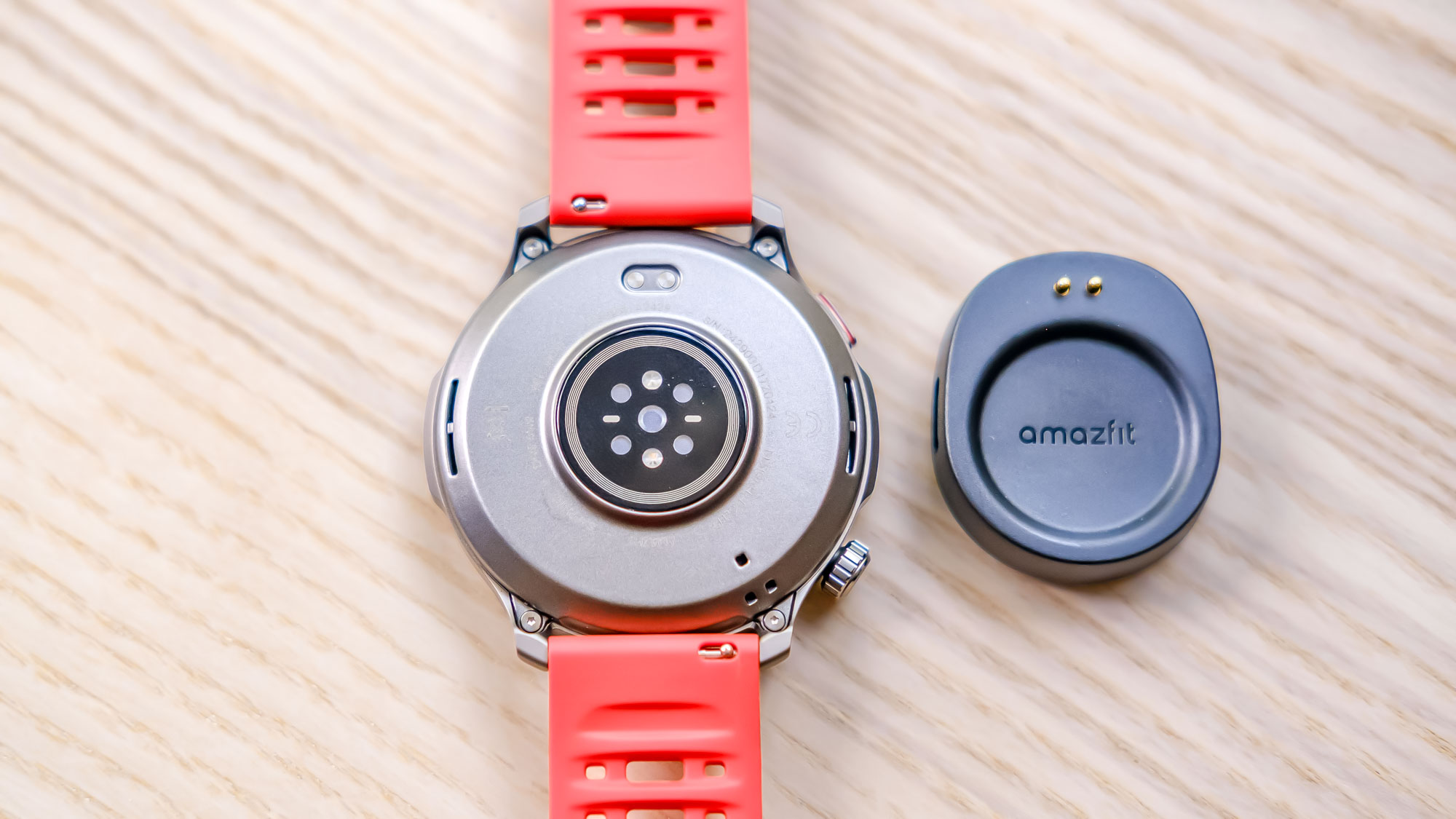 Close-up of the Amazfit Balance 2 smartwatch on an orange rubber strap