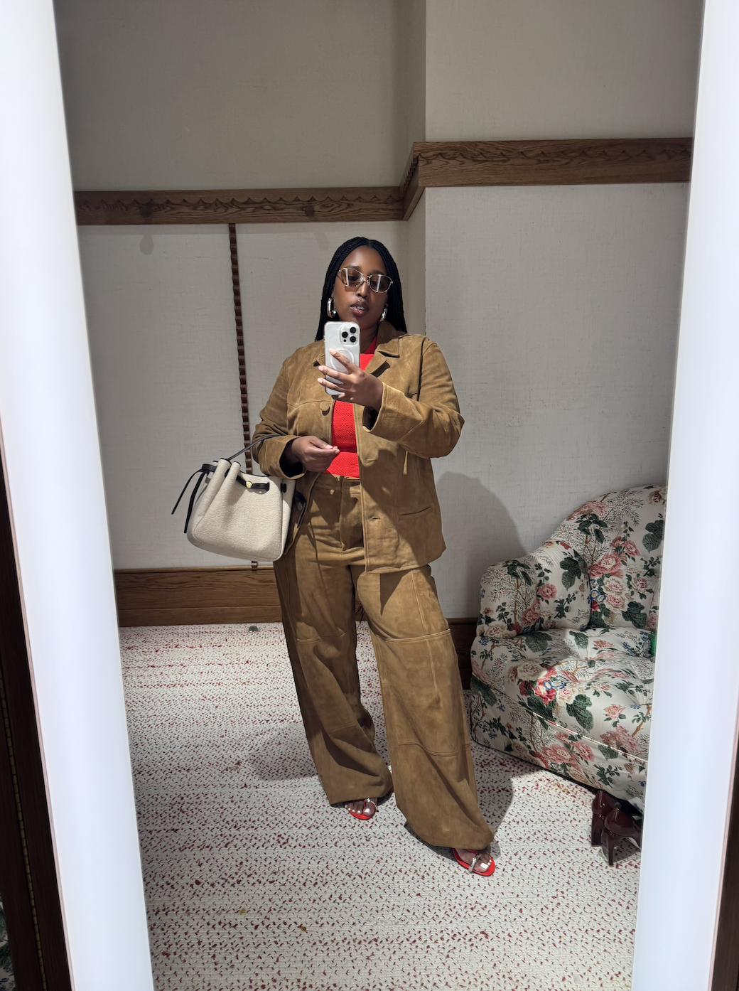 Mecca James-Williams wearing a brown Tory Burch suede jacket and pants