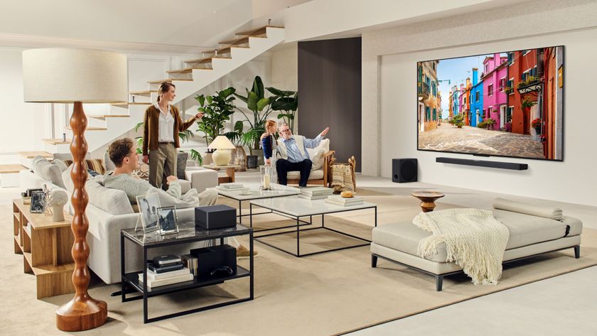 LG QNED TV in bright living room with admiring viewers