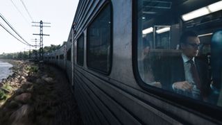 Shot of Liam Neeson in a train