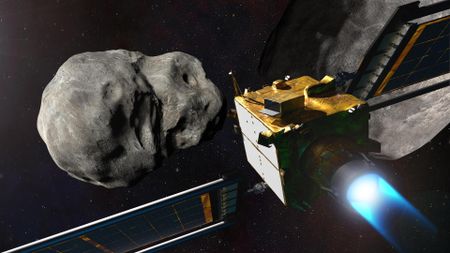 A spacecraft with solar panels heads for an asteroid in the darkness of space